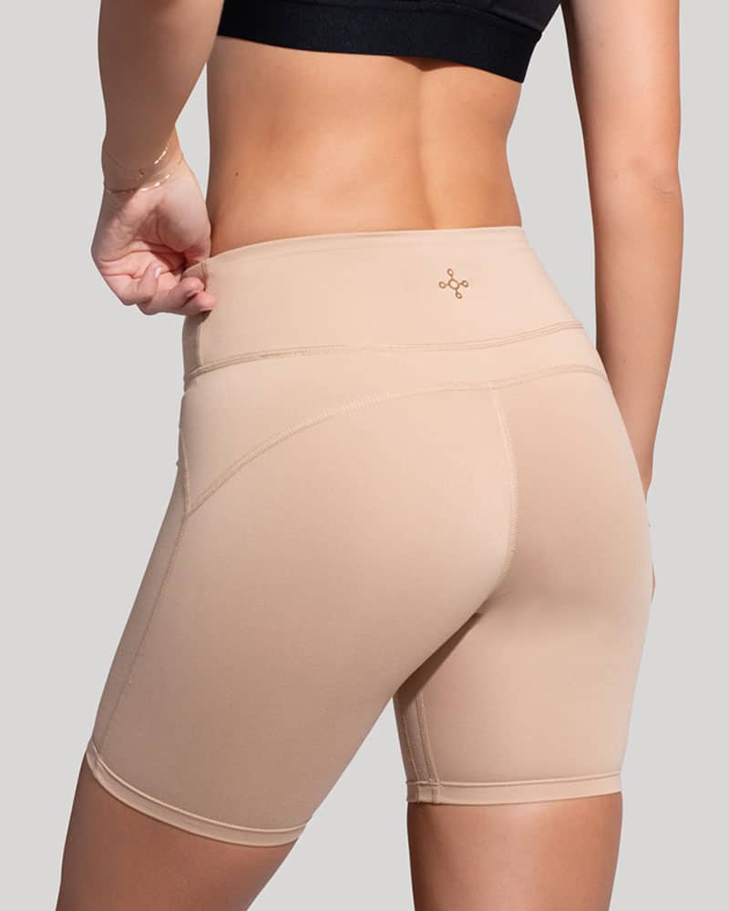 Beige fitted shorts showing waistband and leg length